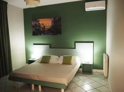 Letto o letti in una camera di La Finestra sui Faraglioni