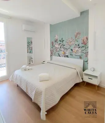 Letto o letti in una camera di White Caves Catania Apartment