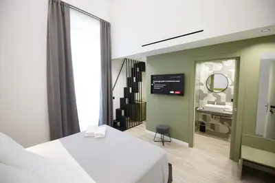 Letto o letti in una camera di MAZZINI PALACE